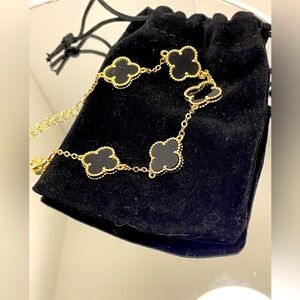 Elegant Gold and Black Clover Bracelet